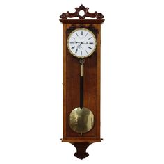 a grandfather clock with pendulum on the wall