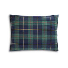 a blue and green plaid pillow on a white background