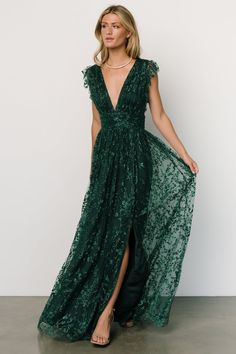 a woman in a long green dress