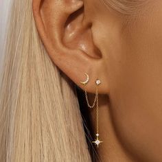 The Celestial Drop Chain Earrings feature a crescent moon and an eight-pointed star connected by a chain. Made from silver and with diamonds, these earrings look magical. Specification:Materials: 925 Sterling Silver Plated With 18K Gold*Nickel free. Gentle on Sensitive Skin.Stone: AAAAA ZirconiaSize: Crescent Moon: 0.9cm/0.354in, Chain Length: 4.8cm/1.889in, Star Pendant: 1.1cm/0.433inWeight: 0.98g/0.034oz Note:Colors may vary slightly due to different shooting angles, lighting, or monitors.Due Eight Pointed Star, Crescent Moon Earrings, M F, Halloween Earrings, Moon Earrings, Earring Sale, Single Earring, Chain Earrings, Star Pendant