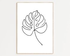 a black and white print with a single line drawing of a large leaf on it