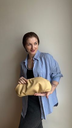 Stylish beige woman clutch. The perfect size for a wedding party, evening walk, going to a party and any other event. Beige women's clutch is always a timeless style. Unique designer women's handbag will fit perfectly into your wardrobe and will be the most favorite handbag for many looks. Size 38*18 cm, perfectly accommodates everything you need: phone, charger, cosmetics, wallet, etc. The set can be a chain in gold or silver color of your choice. I sew individually. If you want this handbag model in another size convenient for you, just note me. I can also offer you a huge selection of inner lining. The handbag will be exclusive. Dumpling clutch keeps its shape without anything inside. Material - ecoleather premium quality. Color from the photo - Beige Bag will come in a nice linen bag. Modern Beige Pouch Evening Bag, Beige Evening Bag With Removable Pouch For Party, Trendy Pouch Clutch For Events, Beige Clutch With Removable Pouch For Party, Chic Clutch For Events, Modern Beige Clutch For Evening, Cream Evening Clutch, Chic Clutch Pouch For Events, Cream Pouch Clutch For Evening