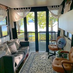 a living room filled with furniture next to a sliding glass door