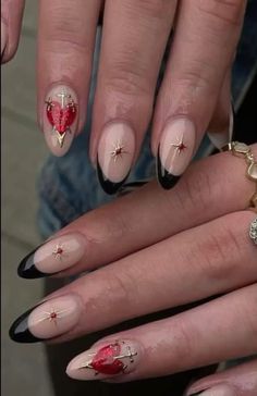 Daring Elegance: These classy nails boast a striking combination of red, black, and gold, exuding sophistication and confidence. With their bold colors and elegant design, they make a daring statement, perfect for those who aren't afraid to stand out and embrace their inner power   ——————————————————————————————  #nails #funnails #nailart #naildesignideas  #nailsofinstagram #nails2inspire #nailsonfleek #nailswag #nailstrend #nailfeature #nailtech #nailartideas [ CREDITS TO OWNER ] Black Red Heart Nails, King Of Hearts Nails, Red And Gold Heart Nails, Gold Chrome Heart Nails, Red And Black Aesthetic Nails, Anatomical Heart Nails, Red Celestial Nails, Dagger Nail Art, Gold And Red Nails Ideas