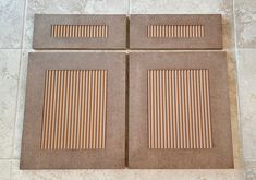 four square tiles with wooden strips on the floor