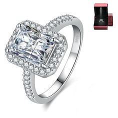 an engagement ring with a square cut diamond surrounded by small round diamonds and red lipstick