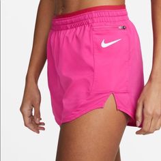 Built In Brief For Enhanced Coverage Expandable Center Front Waistband Size Medium Nike Athleisure Beach Athletic Shorts, Nike Athleisure Athletic Shorts For Beach, Nike Sporty Beach Shorts, Nike Athletic Shorts With Elastic Waistband For Beach, Nike Running Shorts For Summer, Nike Athletic Shorts For Running In Summer, Pink Nike Bottoms For Beach, Pink Nike Bottoms For The Beach, Nike Training Bottoms For Summer