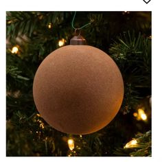 a brown ornament hanging from a christmas tree