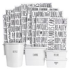 white plastic containers with black and white typogramic designs on the front, one for each container