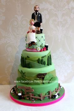 a wedding cake with a bride and groom on top