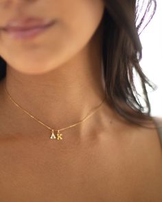 Mini initial necklace, perfect for adding a personal touch to any outfit. Dainty Initial Necklace - Perfect wearing alone or layering with your favorite necklaces. Super dainty & fun. Each initial measures approx. 6X8mm, You can add up to 5 Initials. Available in 14k Yellow Gold filled or sterling silver. --------------------------------------- SHIPPING UPGRADES You can find shipping upgrades options in the drop bar menu when you check out. + Within the U.S Regular First-class : 2-6 business 2 Initial Necklace, Dainty Initial Necklace With Charms For Personalized Gift, Dainty Initial Necklace With Charms For Gift, Dainty Initial Pendant Name Necklace With Charms, Dainty Initial Pendant Charm Necklace For Gift, Dainty Initial Pendant Charm Necklace As Gift, Dainty Charm Necklace With Initial Pendant As A Gift, Minimalist Initial Necklace With Charms As Gift, Dainty Initial Pendant Necklace With Charms