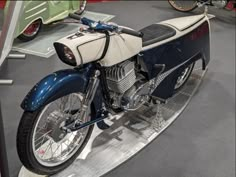 a motorcycle is on display in a museum