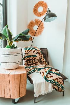 a living room with a couch, table and potted plant