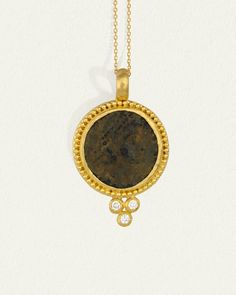 A 24k gold pendant with gold ball detailing and natural diamonds. Shop Antique Coin Necklace with authentic one-of-a-kind coin artefact. Yellow Gold Medallion Necklace With Coin Pendant, Luxury Yellow Gold Coin Pendant Necklace, Yellow Gold Amulet Coin Necklace, Yellow Gold Coin Pendant Necklace In Amulet Style, Luxury Gold Coin Medallion Necklace, Luxury Yellow Gold Coin Medallion Necklace, Luxury Engraved Coin Necklace, Luxury Gold-plated Coin Necklace With Round Pendant, Luxury Gold Plated Coin Necklace With Round Pendant