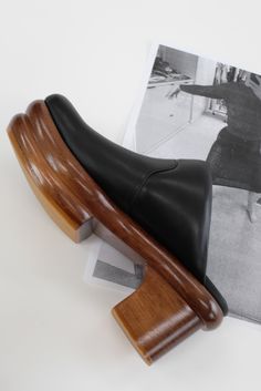 Artfully hand carved double wooden platform heel, 100% soft leather uppers and leather lined, lacquered 1 3/4" to 3" platform heel. Ultra comfortable, padded, all-day-wearable, wood clog. Free of staples. If between sizes we suggest going up a half size. Sedia is the Italian word for chair. Made fairly in Peru. Black Closed Toe Clogs With Sculpted Heel, Leather Sole High Heel Clogs For Work, High Heel Clogs With Leather Sole For Work, High Heel Clogs With Sculpted Heel For Work, Workwear Clogs With Sculpted High Heel, Black Leather Clogs With Sculpted Heel, Leather Clogs With Sculpted Block Heel, Modern Black Clogs With Sculpted Heel, Black Clogs With Sculpted High Heel