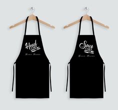 two black aprons with the words good and sour on them hanging from a wooden hanger