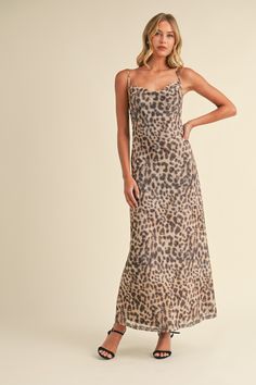 This Feline Fancy Dress showcases a bold leopard print and a stylish cowl neckline. Made with mesh material, it stands out in any crowd. With its maxi length, it is the perfect statement piece for a fancy night out. 95% polyester, 5% spandex Return Policy WE ONLY OFFER STORE CREDIT FOR RETURNS! Feel free to email us at info@shopluxxeapparel.com or DM us with any questions regarding fit, styling, or our return policy in general. To read more into our return policy please click here. Fitted Cowl Neck Maxi Dress For Date Night, Chic Leopard Print Party Maxi Dress, Fall Party Maxi Dress In Leopard Print, Spring Leopard Print Maxi Dress For Night Out, Leopard Print Maxi Dress For Fall Party, Leopard Print Fitted Maxi Dress For Date Night, Fitted Leopard Print Maxi Dress For Date Night, Fall Chic Leopard Print Maxi Dress, Chic Leopard Print Maxi Dress For Fall