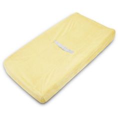 a yellow baby crib mattress on a white background