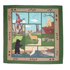 an image of a bear and other animals in the woods on a quilted wall hanging