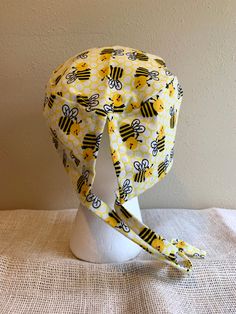 Busy Bees Flannel Standard Scrub Cap. Fits one-size-fits-most, but has adjustable drawstring. Fabric pattern placement varies between caps. Great for Doctors, Nurses, Veterinarians, Vet Techs, and other medical professionals. Made from 100% cotton flannel fabric. Machine washable. Select With Snap Closure to have the cap made with an extra snap added to the back opening to help keep it closed and hair inside the cap. See photos for example. All caps will be made with an adjustable drawstring tie Adjustable Yellow Cotton Hat, Adjustable Fun Style Bonnet Cap, Fun Adjustable Cap-shaped Bonnet, Adjustable Fun Beanie Bonnet, Fun Adjustable Beanie Bonnet, Adjustable Brimmed Cotton Bonnet, Adjustable Yellow Sun Cap, Baleen Whales, Pink Scrubs