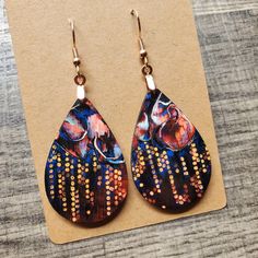 This pair of lightweight, teardrop earrings adds a unique touch, featuring original neuro-inspired artwork, "Decoding Hope". They are artsy, vibrant and a creative way to advocate for healthy thought patterns. A unique accessory for anyone needing a gentle reminder, but also eye-catching jewelry for those in neuroscience, counseling or medical professions. "'Decoding Hope' depicts a colourful cluster of neurons growing in connective solidarity, recircuiting around an area of damage. This speaks to hope's endeavor to convert our lived realities into a more comprehensible form in which we learn to recognize and interpret hope's "code". If you are interested in the original artwork that inspired this item or seeing more from the art collection, visit Geinene.com or follow me on Instagram @Gei Artisan Teardrop Earrings With Artistic Design, Festival Teardrop Earrings With Ear Wire, Adjustable Teardrop Artsy Earrings, Artistic Teardrop Earrings As Gift, Artsy Teardrop-shaped Earrings, Artsy Multicolor Teardrop Jewelry, Unique Handmade Multicolor Teardrop Earrings, Artsy Dangle Earrings With Artistic Design, Unique Multicolor Teardrop Earrings For Gift