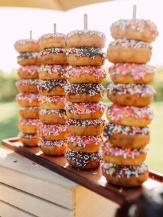 several donuts stacked on top of each other with sprinkles in them