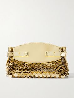 Ferragamo debuted this version of the iconic 'Hug' bag on the Fall '24 runway - the collection is inspired by the glamour of the 1920s. Made from metallic gold leather, this clutch is embellished with rows of paillettes for added sparkle and comes with a crossbody strap so you can go hands-free. Stow your phone, wallet and compact in the spacious interior. Luxury Evening Bag With Gold-tone Hardware For Gala, Luxury Gold-tone Evening Bag For Gala, Luxury Clutch With Gold-tone Hardware, Luxury Clutch With Gold-tone Hardware For Events, Designer Gold Clutch With Detachable Handle, Designer Clutch With Gold-tone Hardware For Events, Luxury Gala Bags, Designer Gold Clutch For Gala, Cinch Bag