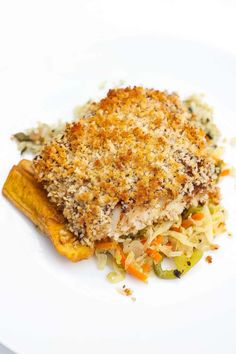 a white plate topped with meat and veggies covered in grated parmesan cheese