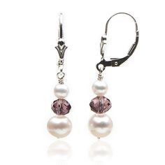 Great earrings for a special night out. Soft pink Swarovski crystals pair beautifully with our smooth freshwater pearls creating a dreamy and enchanted look. Impress your Prince Charming with these stunning earrings and the perfect dress.Pearl Type: Freshwater Cultured PearlPearl Shape: RoundPearl Color: Natural WhitePearl Luster: HighPearl Uniformity: ExcellentPearl Size: 4 and 7 mmSemi-precious: Swarovski CrystalsLever-back: Sterling SilverDrop 1 inch Earrings handmade in Chicago by I Do Pearl Earrings Diamond Studs, Drop Earrings Simple, Pink Crystal Earrings, Dress Pearl, Crystals Earrings, Gold Jewelry Gift, Beaded Earrings Diy, Pearl Dangle Earrings, Pink Swarovski