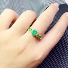 >>>> BASIC INFORMATION <<<< Gemstone: Natural Emerald.Gemstone Origin: Colombia.Natural Stone Size: oval 4 Pcs 2*3mm + oval 1 pc 4*6mm.Side stones: dainty CZ diamond (shining cubic zircon).14k gold plated emerald ring.14k rose gold plated emerald ring925 sterling silver natural emerald ring.>>>> CUSTOM METALS <<<< Ring Size: From US 5 to US 11.Customized Metal: The sell price is defaulted metals are Sterling Silver, Rose Gold Plated in Silver and 1 Oval Green Gemstone Birthstone Ring, Oval Green Gemstone Cluster Ring, Green Oval Opal Ring, Oval Emerald Ring Fine Jewelry, Oval Emerald Ring With Stone Setting For Promise, Oval Rings With Stone Setting, Oval Promise Ring With Stones, Green Oval Diamond Birthstone Ring, Oval Gold Emerald Ring With Stone Setting