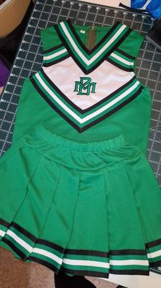 Cheerleading costume, constructed of ponte knit fabric, and knit braid. Bloomers are not included. Machine wash and dry. Smoke free and pet free home. Many colors and sizes available. If you have a special request convo me. Fitted Cotton Sets For Coming Home, Cotton Fitted Coming Home Outfit Sets, Winter School Sets With Fitted Stretch, Green Fitted Sports Sets, Green Cotton School Sets, Fitted Green School Sets, Fitted Green Sets For School, Fitted Cotton Cheerleading Sets, Cheerleading Costume