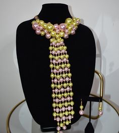 Elegance and style in our Pearl Tie Necklace. Pair with your favorite blouse or Dress. This statement piece does all the talking. Each necklace includes a matching pair of earrings. Chic Yellow Jewelry For Party, Elegant Yellow Necklace For Party, Elegant Multicolor Beaded Necklaces For Party, Elegant Green Bib Necklace For Party, Pearl Tie, Tie Necklace, Statement Pieces, Pink And Green, Statement Necklace