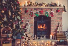 a living room filled with furniture and a fire place covered in christmas stockings next to a fireplace