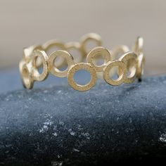 "Very chic and trendy jewelry piece, this gold filled ring is handmade with a unique and stylish design. A chic piece you can wear with other dainty, stacking rings to create your own wonderful style. Why purchase this gold ring? One you can wear on an everyday basis and mix or match with other pieces✅ The ring is expertly handmade with craftsmanship and high-quality materials ✅ Available in ring sizes 5 to 10 ½ US ✅ Wearable alone or with other stacking ring pieces ✅ Thoughtfully packaged in a Gold Stackable Rings As Gift, Gold Stackable Circle Rings As Gift, Gold Stackable Round Rings For Promise, Gold Stackable Rings Made Of Recycled Gold, Adjustable Round Midi Rings In Recycled Gold, Adjustable Recycled Gold Midi Rings, Modern Gold Stackable Rings, Yellow Gold Circular Jewelry With Ring Detail, Everyday Gold Circle Midi Rings