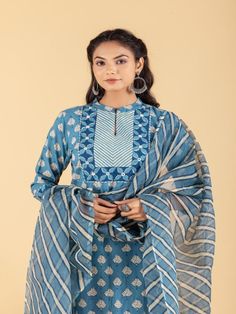 Blue dabu flower printed straight kurta, has a mandarin collar, mirror and katha embroidered yoke, three-quarter sleeves and stripes Print afgani Pants has Elasticated Waistband Fabric: 100% Cotton Color: Blue Note: Available in other colors Wash Care Instruction - Dry Clean Only The product will be shipped within 15-20 days of order placed Size Chart: Kurta Size XS S M L XL XXL XXXL Bust 36 38 40 42 44 46 Waist 32 34 36 38 40 42 Hip 38 40 42 44 46 48 Shoulder 14 14.5 15 15.5 16 16.5 Armhole 18 Indigo Printed Straight Kurta Set, Spring Block Print Straight Kurta Set, Indigo Straight Kurta Sets With Dabka Detail, Indigo Straight Kurta Set With Dabka, Indigo Dabka Straight Kurta Sets, Long Sleeve Chanderi Churidar With Block Print, Indigo Cotton Sets With Dabka Detailing, Indigo Straight Kurta Set For Eid, Chanderi Block Print Churidar With Long Sleeves