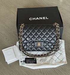 Elevate your style with this exquisite Chanel Classic Jumbo Double Flap Bag in black lambskin leather and gold-plated hardware. The iconic rectangular shape and quilted pattern add a touch of sophistication to any outfit. The bag features a turn-lock closure and a shoulder strap made of leather and metal for easy and comfortable wear. Inside, you'll find inner and outer pockets and an adjustable chain strap for versatility. Comes with original store tags, booklet, felt protectors, authenticity card, original dust bag, and box. Bag has some scratches and tarnishing of metal hardware, along with some slight creasing and scratches on leather, but is still in very good condition. Box is slightly pushed in on one side, but still in tact and functional. This beautiful bag was produced in 2016-20 Chanel Classic Jumbo, Vintage Chanel Bag, Quilted Pattern, Box Bag, Vintage Chanel, Metal Hardware, Flap Bag, Beautiful Bags, Lambskin Leather