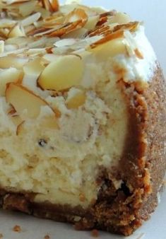 a piece of cheesecake with nuts on top