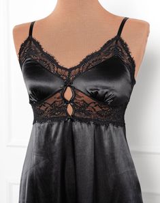 A sweet but sexy top drawer favorite with satin, lace and decorative bows. Elegant Black Lace Top With Built-in Bra, Lace Top With Lace Bodice For Night Out, Black Lace Top For Party With Lace Detail, Black Lace Party Tops, Black Lace Tops For Party, Elegant Lace Top With Built-in Bra For Night Out, Black Lace Top With Lace Patchwork For Night Out, Lace Top With Built-in Bra For Night Out, Party Lace Trim Cami Top