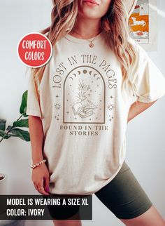 This Mystical bookish shirt proudly declares your love for books and the excitement of embarking on new reading journeys. Wear this shirt and let everyone know that you're a dedicated bookworm. For other similar stuffs, click here: https://www.etsy.com/shop/TheNims?section_id=33576831 Browse through my other awesome items here: http://thenims.etsy.com/ ABOUT THE PRODUCT: UNISEX TEES | Comfort Colors® 1717 (CUSTOMER FAVORITE) * Medium fabric (6.1 oz/yd² (206.8 g/m * Relaxed fit * Sewn-in twill la Relaxed Fit Graphic Print Shirt In Bookish Style, Relaxed Fit Graphic Print Shirt With Bookish Style, Banned Books Shirt, I Read Banned Books, Library Shirt, Witchy Clothes, Literature Shirt, Literary Shirts, Read Banned Books