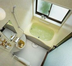 an aerial view of a bathroom with a tub and sink