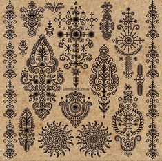 an old paper with black and white designs on the bottom, in different shapes and sizes