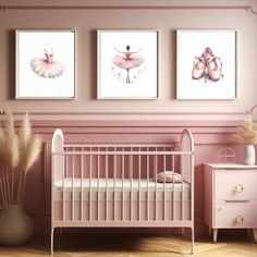 a baby's room with pink walls and pictures on the wall