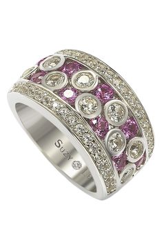 This beautiful sterling silver ring flaunts modern chic style with pavé natural pink sapphires (1.34 ct), bezel set created white sapphires (2.41 ct), and a natural fancy brown diamond (.02 ct) hand set in sterling silver. A unique designer Suzy Levian gallery logo in 18K gold plate offers signature style. The closed under-gallery ensures a comfort fit. The hidden brown diamond set in the shank of this ring encourages women to discover their inner strength, power and beauty. Total gem weight: 3. Sl Logo, Gemstone Brooch, Cubic Zirconia Bracelet, Cubic Zirconia Jewelry, Jewelry Rings Diamond, Creating Jewelry, Brown Diamond, Gemstone Necklace Pendant, Pink Ring