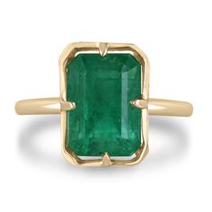 Modern Emerald Rings With Center Stone, Formal Rectangular Emerald Ring With Prong Setting, Emerald Baguette Cut Ring With Bezel Setting, Bezel Set Baguette Cut Emerald Ring, Baguette Cut Bezel Set Emerald Ring, Baguette Cut Emerald Ring With Bezel Setting, Modern Emerald Cut May Birthstone Jewelry, Timeless Gia Certified 14k Gold Emerald Ring, Fine Emerald Jewelry In Rectangular Shape