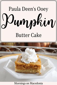 a piece of pumpkin butter cake on a white plate with the words, paul denn's ooey pumpkin butter cake