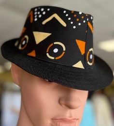 Clean and sophisticated fedora.Black Fedora with a african fabric ,orange feather and black design around crown .This Fedora is beautiful and unisex. The fedora looks great for any season . Comfortable fits small to med size heads.Don't delay order yours today. Fitted Black Fedora For Festivals, Fedora Women, Women Fedora, African Hats, Hat Wedding, Church Hat, Wedding Hat, Golf Hat, Church Hats