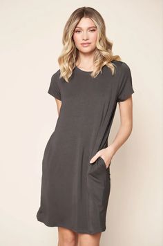 The Weekender T-Shirt Mini Knit Dress is ideal for any day of the week. This dress has a crew neckline, short sleeves, and best of all, pockets! With a relaxed shift dress fit and soft comfortable knit jersey fabric, you'll never want to take it off. Pair it with sneakers or cute sandals for an easy comfy look. T-shirt dress Comfy knit jersey fabric Short sleeve V Neckline Color: Charcoal Size + Fit Model is 5'9" and wearing size S Measurements are taken from size S Chest: 40 1/2" Length: 34" Se Jersey Knit Dress, Cute Sandals, Jersey Knit Fabric, Fit N Flare Dress, Dress With Pockets, Jersey Dress, Fitted Dress, Jersey Fabric, Flare Dress