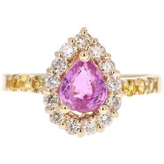 Cute Pink Sapphire and Diamond Ring! Can be an everyday ring or a unique Engagement Ring! This beautiful ring has a Pear Cut Pink Sapphire that weights 1.11 Carats. The ring is embellished with 14 Round Cut Diamonds that weigh 0.41 Carats with a clarity and color of VS/H as well as 6 Yellow Sapphires on the shank of the ring weighing 0.28 Carats. The total carat weight of the ring is 1.80 Carats. The ring is beautifully set in 14K Yellow Gold with an approximate weight of 3.3 grams. It is a size Fine Jewelry Pink Sapphire Diamond Ring With Multi-stones, Fine Jewelry Pink Sapphire Multi-stone Diamond Ring, Gia Certified Yellow Gold Cluster Ring, Yellow Gold Sapphire Ring With Halo Setting, Fine Jewelry Yellow Gold Sapphire Ring With Halo Setting, Gia Certified Fine Jewelry Pink Sapphire Diamond Ring, Fine Jewelry Gia Certified Pink Sapphire Diamond Ring, Gia Certified Pink Sapphire Diamond Ring In Fine Jewelry, Gia Certified Pink Sapphire Diamond Ring