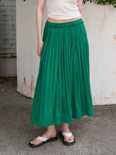 Editor's NoteThis is a long skirt with mechanical pleats from the waist and a straight, falling silhouette that stands out for its slenderness.- Banded at the waist for a comfortable fit- It is composed of colors that are good to wear in summer, so you can coordinate coolly- Lined for stable wear- Available in 2 colors: White, GreenMeasurements (in.)55 / 66- Length: 33.86 in. / 34.65 in.- Waist circumference: 25.98 in. / 27.95 in.Composition & Care- Shell: 65% Rayon, 35% Polyester   Color fabric: 100% Polyester   Lining: 100% Polyester- Please check the care labelDesigner- by OLIVE DES OLIVE High-waisted Pleated Work Skirt, Spring Pleated Waist Flowy Skirt Bottoms, Spring Pleated Waist Flowy Skirt, Spring Green Pleated Maxi Skirt, Wide Leg Pleated Skirt With Elastic Waistband For Spring, Accordion Pleats Flowy Maxi Skirt, Solid Color Flowy Maxi Skirt With Pleated Waist, Flowy Solid Color Maxi Skirt With Pleated Waist, Solid Midi Skirt With Folds