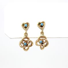 Delightful vintage 14k yellow gold Victorian Revival dangle earrings! These mid century earrings feature a total of four stunning simulated turquoise stones, which are securely prong set. The earrings contain love knot & engraved designs, along with heart motifs. Incredible vintage earrings! *Sale - price reduced from $325 USD to $310 USD. ERA - Circa 1960s - Mid Century METAL / MATERIAL - 14k gold earrings & backs, 4 simulated turquoise MARKINGS / HISTORY - Earring backs are marked 14k  CONDITI Vintage Yellow Gold Dangle Earrings, Retro Yellow Gold Earrings, Vintage 14k Gold Dangle Earrings, Vintage Yellow Gold Dangle Jewelry, Vintage 14k Gold Jewelry With Matching Earrings, Vintage 14k Gold Earrings, Vintage 14k Gold Dangle Jewelry, Vintage 14k Stamped Wedding Earrings, Vintage 14k Stamped Earrings As Gift